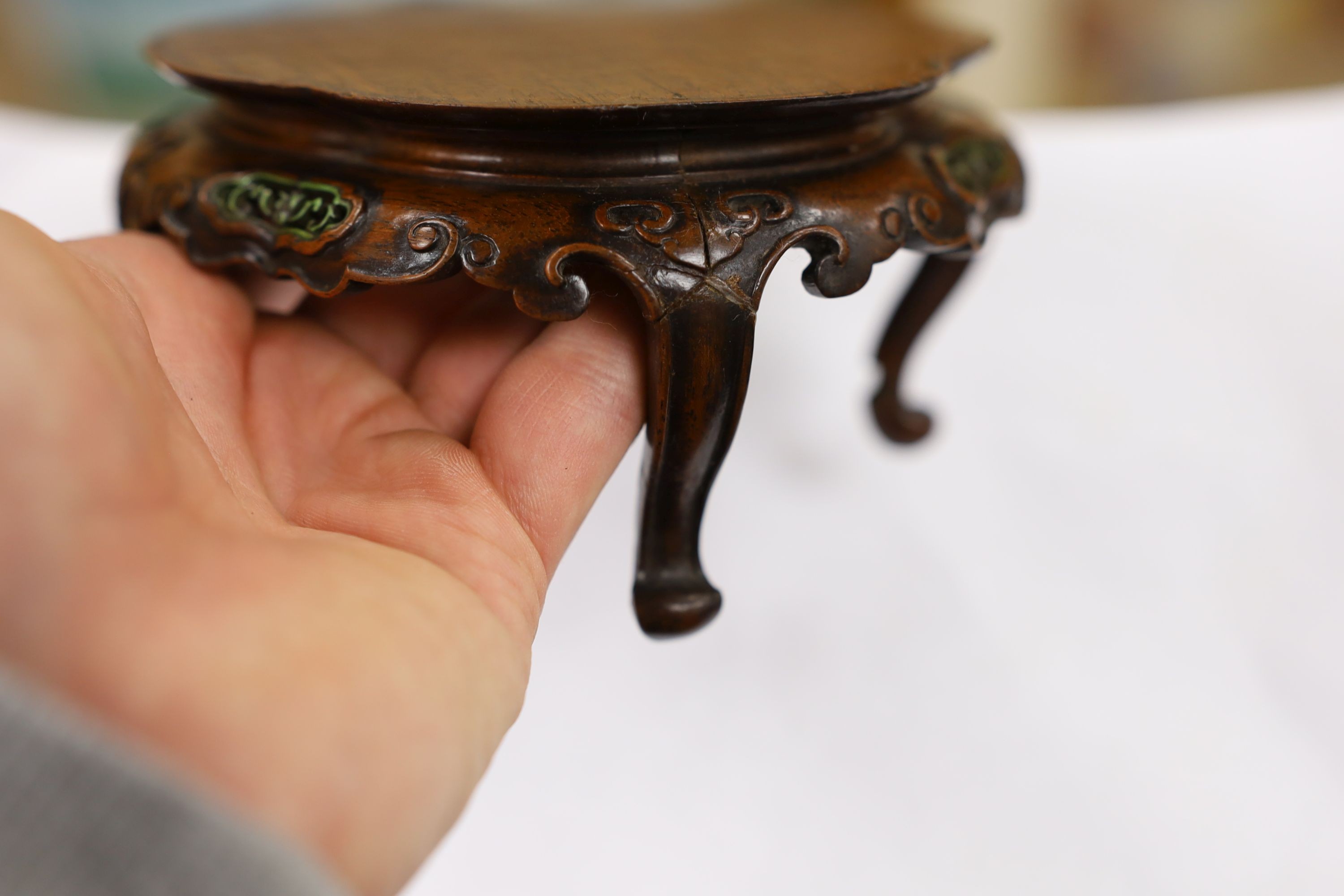 A fine Chinese oval hardwood and green stained Ivory inset stand, Qing dynasty, lacking stretcher, 15 cms wide.